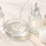 Hydration concept showing transparent gel textures and water droplets in a clean, minimalist skincare setting